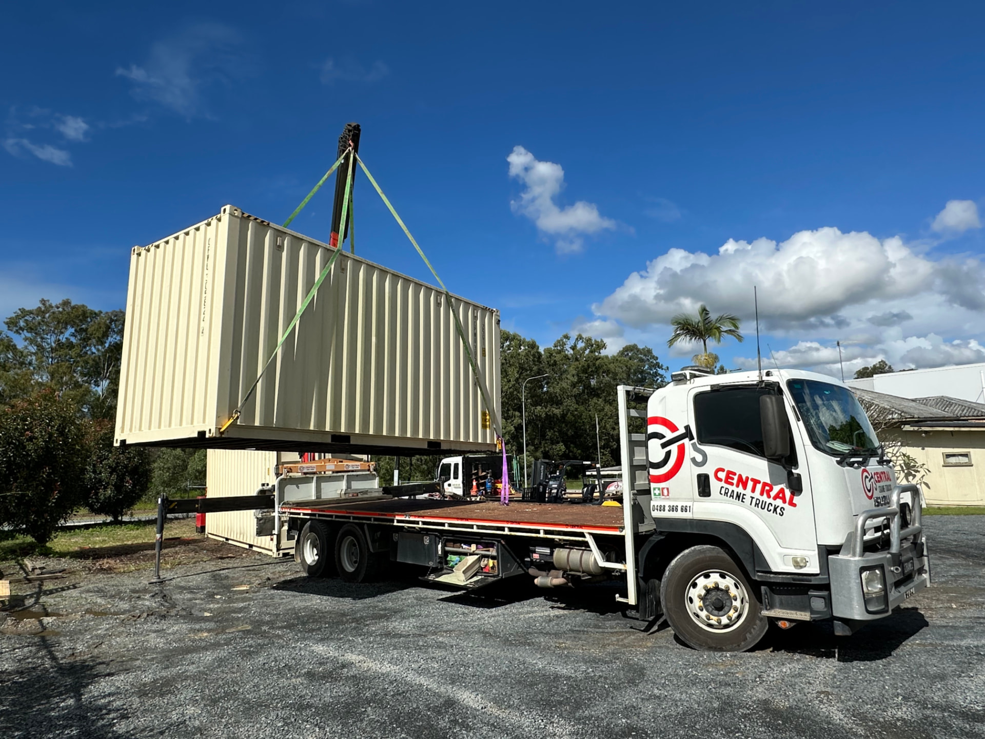 Central Crane Trucks crane truck lifting a shipping container into place in Brisbane